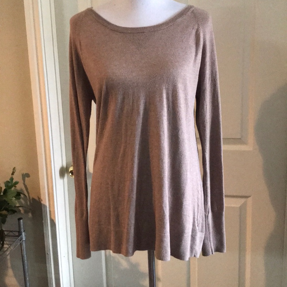 Beige sweater with cable knit details